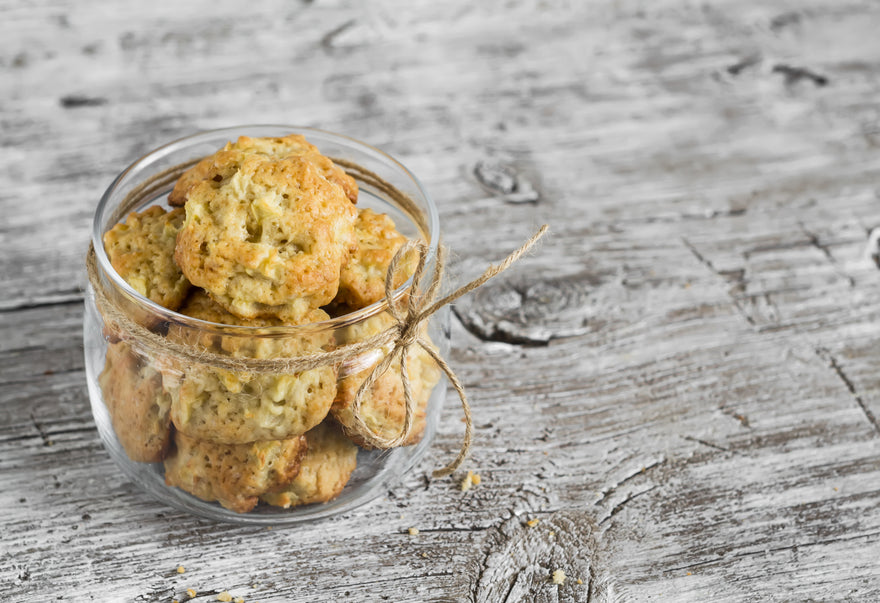 Glass jar full of cookies sitting on kitchen counter