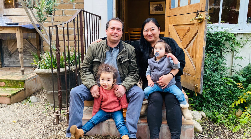 Shiho's family sitting on front porch steps