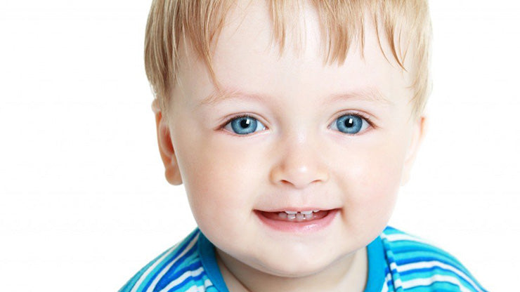 Smiling blonde, blue-eyed toddler