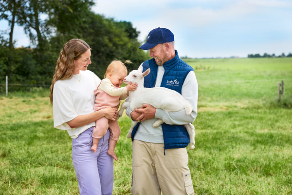 Kabrita goat with farmer and baby